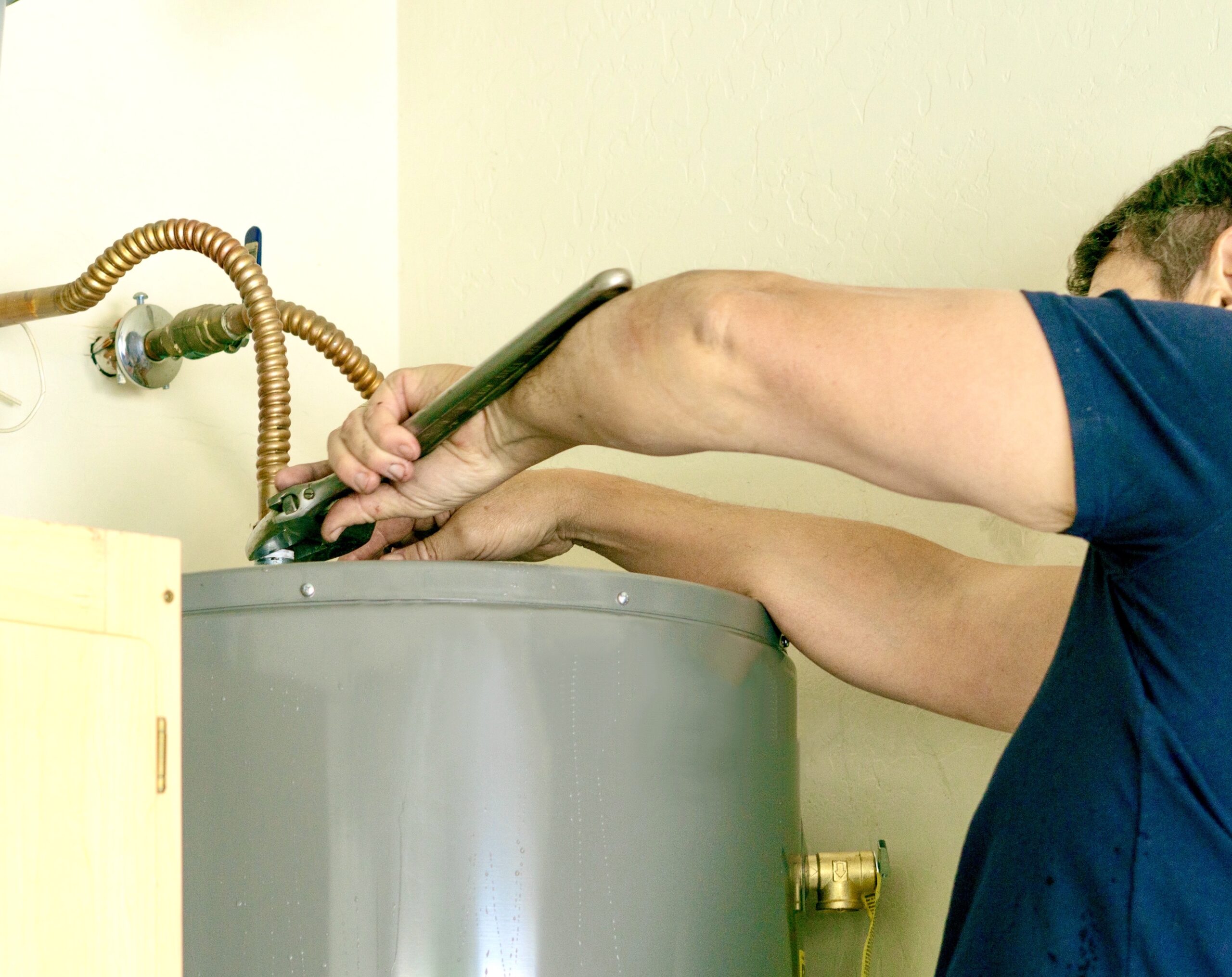 adult-male-using-a-wrench-to-make-adjustments-on-t-2021-08-29-05-54-19-utc