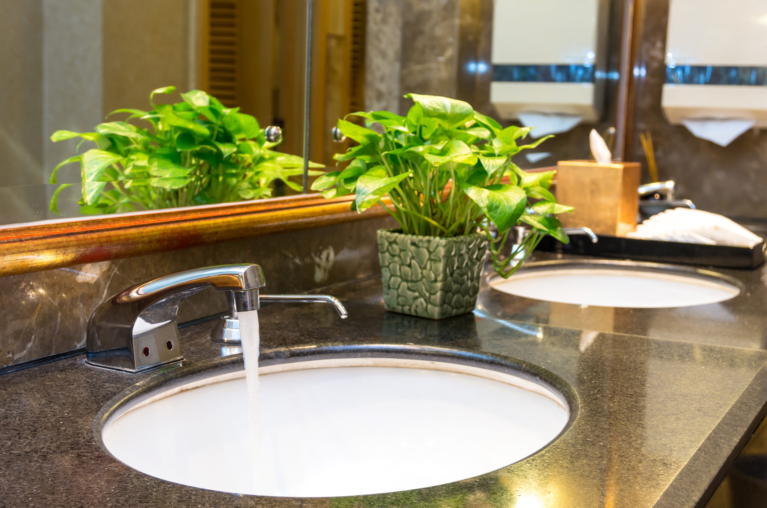 Luxury Chrome faucet with washbasin in modern toilet, focus on F